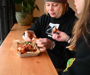 Ladies eating some fried chicken